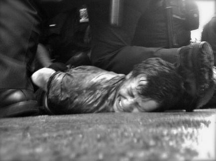 Occupy Wall Street man on ground being arrested 02