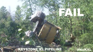 NOTE: The worker in the feller buncher was not hurt. It tipped over as they tried to clear cut more trees in the path of the Keystone XL. The blockade was not involved.