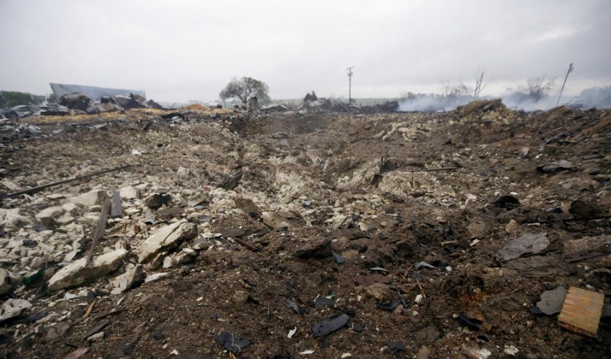 A blast crater sits in the remains of a fertilizer plant destroyed by an explosion in West, Texas, Thursday, April 18, 2013. (AP Photo/LM Otero) Source