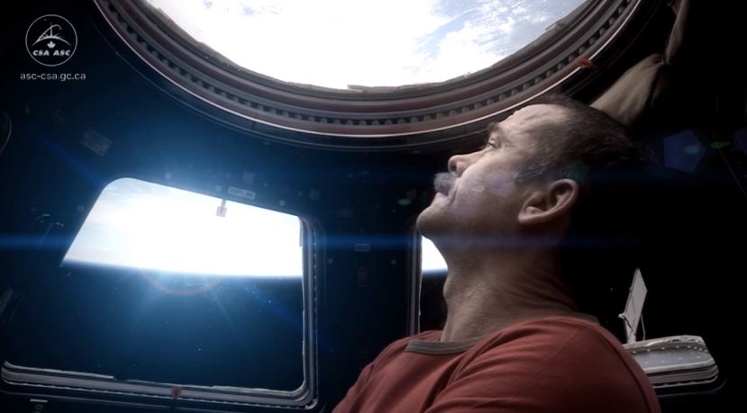 Chris Hadfield ISS singing Space Oddity looking out window